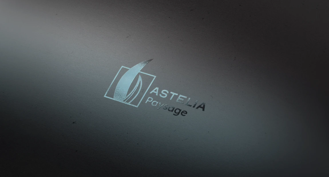 Logo Astelia paysage en marquage à chaud bleu glacier sur papier gris anthracite, simulation d’impression