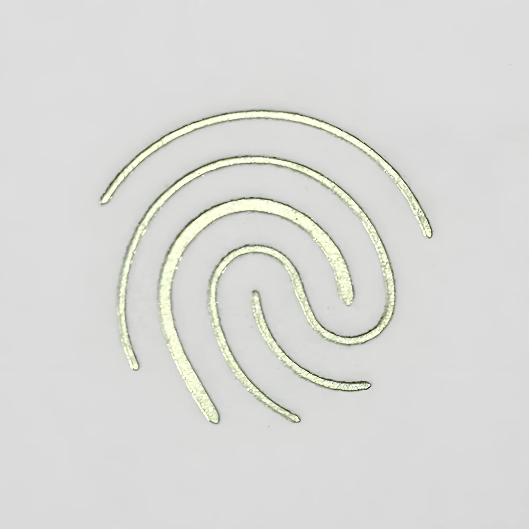 Empreinte digitale d’Orma en marquage à chaud vert pâle sur papier coton blanc, signature de l’atelier de menuiserie